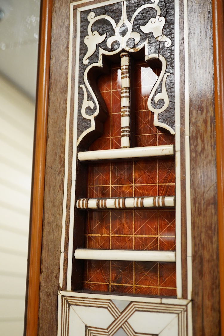 A Moroccan bone and abalone inlaid wall mirror